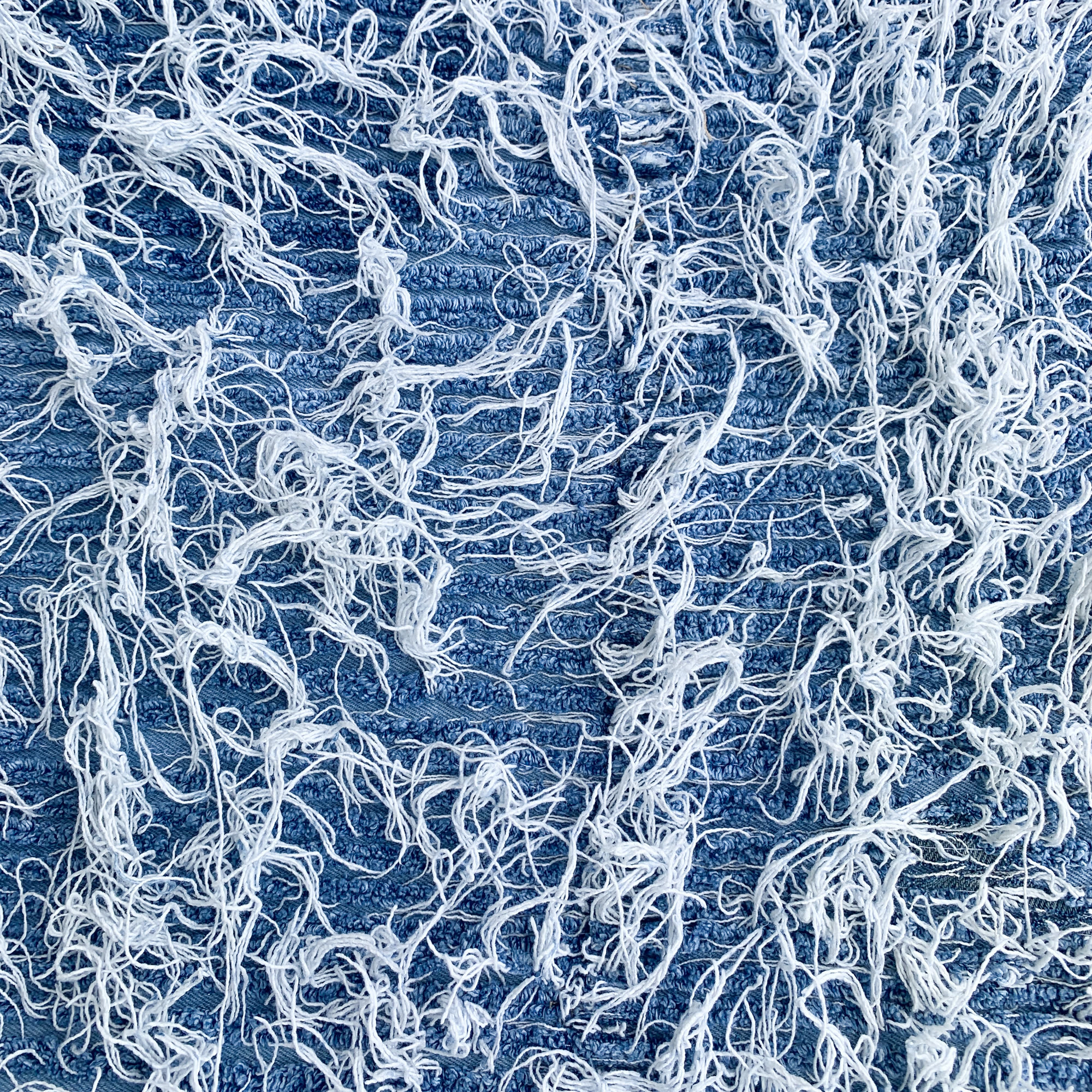 All-over frayed denim fabric