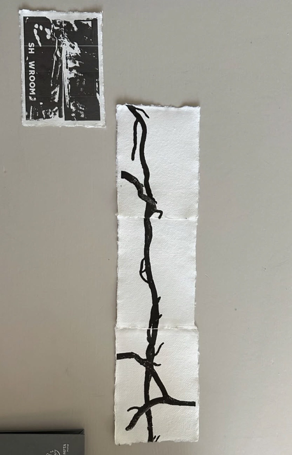 Vertical branch and root print on handmade deckle-edge paper